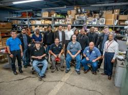 Montclair’s first cohort of Facilities apprentices are shown with their mentors, Facilities management and the University President. Seated from left, Keith Benjamin, Kevin Johnson, Patrick Hickey and Kevin Lepore. Standing from left, Rajendra Shah, David Lobefaro, Dwight Threepersons, Jhoan Noguiera, Shakira Jackson, Shawn Connolly, Montclair President Jonathan Koppell, Daniel Miller, Amy Ferdinand, Kevin Rizzo and Joseph Marzulla.